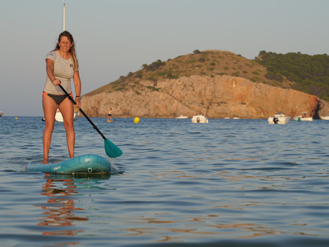 Woman on a stand up paddle board in Spain