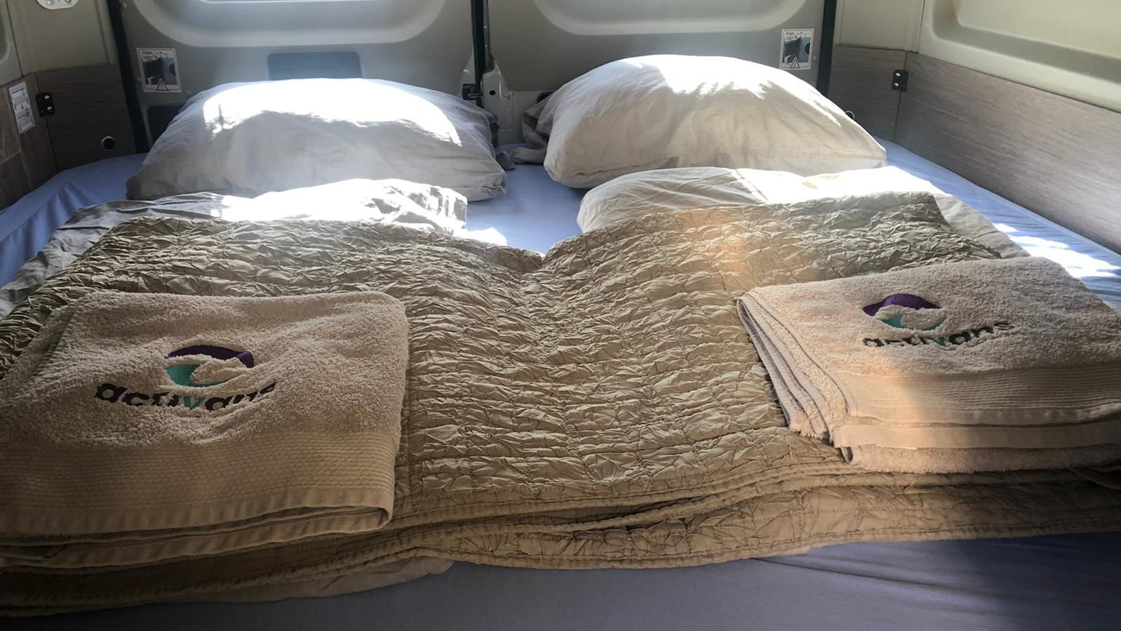 prepared bed in the campervan